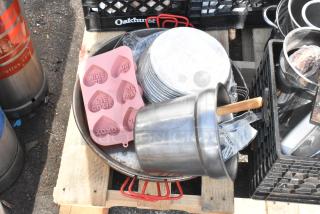Pallet lot with baking pans, skillets, pink heart mold, and metal pot. Items in good condition, mixed types for kitchen use.