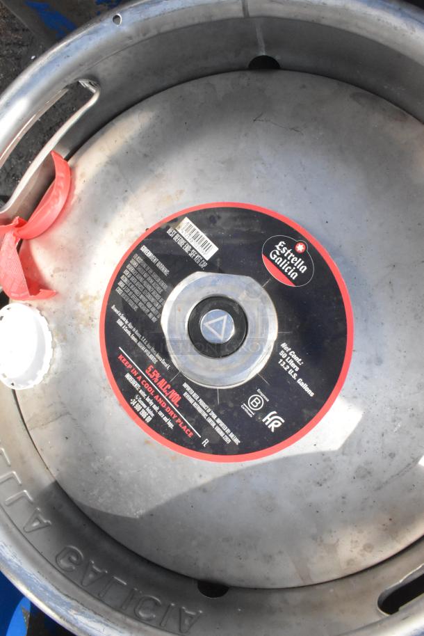 Metal keg labeled "Estrella Galicia," 30 liters, 5.5% ABV, visible markings and labels. '12x Your Bid' auction lot.