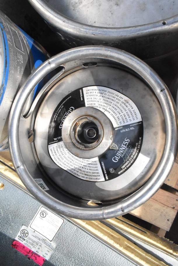 12 various kegs, including a Guinness keg with label showing alcohol content as 4.2%. Used condition.