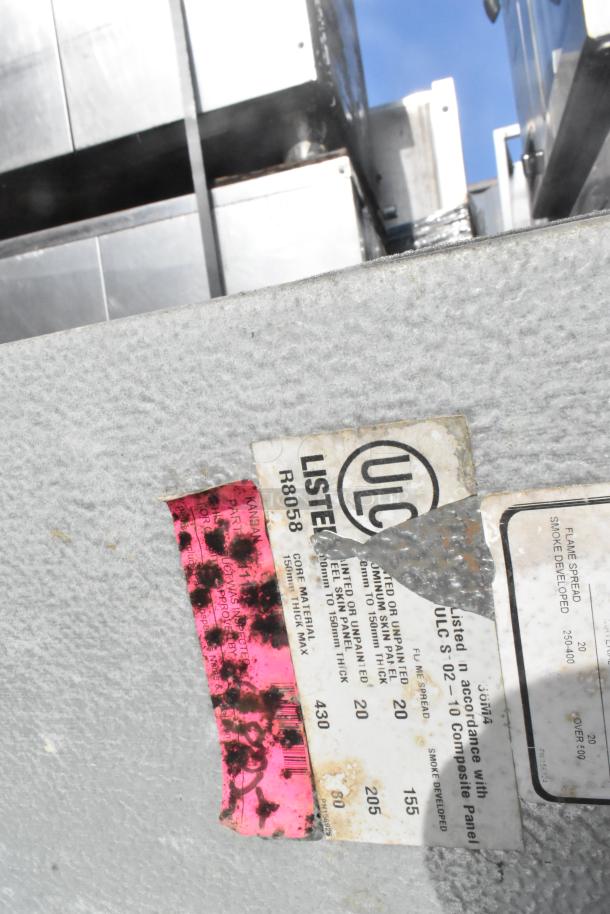 Walk In Box panel with ULC label, model R8058. Features include insulated panels and core material specs. Some wear visible.