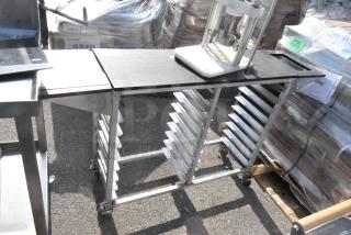 Commercial double pan rack with multiple shelves, on sturdy commercial casters for easy mobility, in good condition.