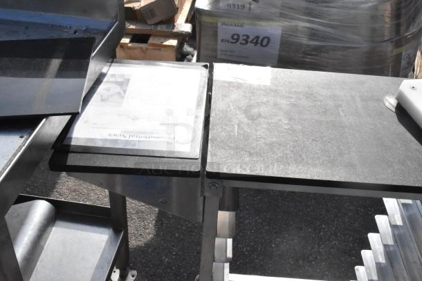 Commercial double pan rack on sturdy commercial casters, silver metal. Ideal for kitchen use, holds multiple pans securely.