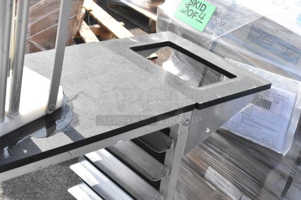 Commercial double pan rack on casters, stainless steel, holds multiple trays. Visible water marks, label shows "SKID 3 OF 4."