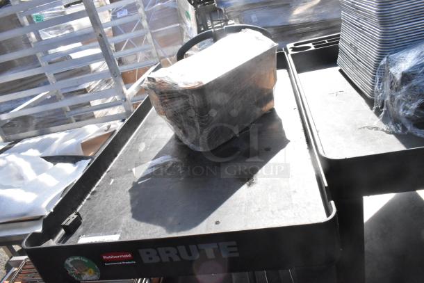Rubbermaid Brute Poly 2 Tier Cart with contents, featuring commercial casters and visible brand labels.