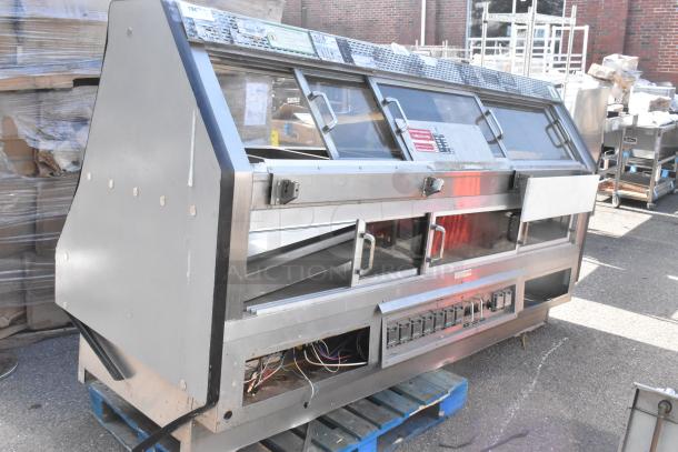 Custom Deli's DILN8CRSS commercial heated display case, floor style, stainless steel, 120/208V, 1 phase, used condition.