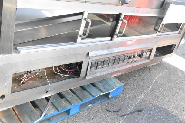 Custom Deli's DILN8CRSS heated display case, commercial floor style, 120/208V, 1 phase, visible wiring and controls.