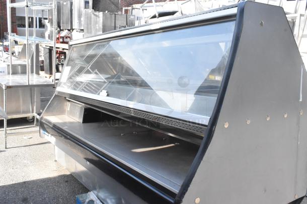 Custom Deli's DILN8CRSS heated display case, floor style, glass front, black exterior, good condition, 120/208V, 1 phase.