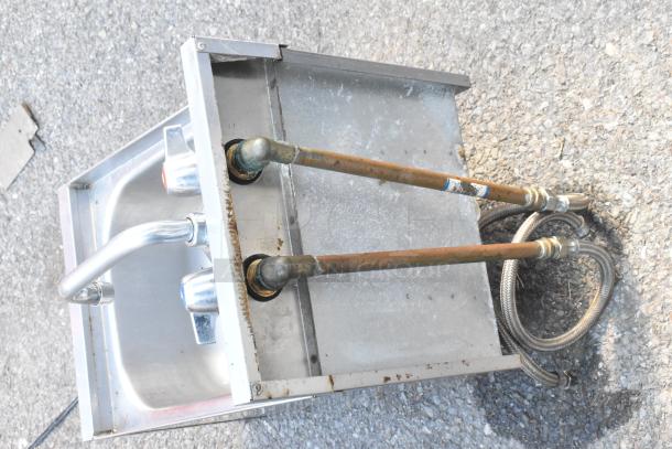 Commercial single bay sink, stainless steel, no legs, with faucets and plumbing attachments, fair condition, rust on pipes.