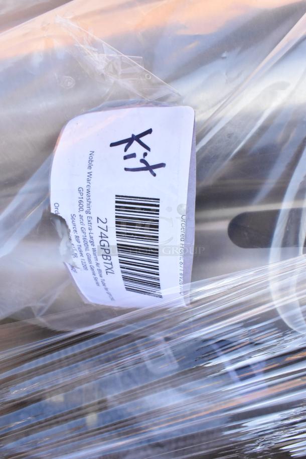 New scratch and dent items including CO2 tank wrapped in plastic. Label reads "Noble Warewashing Extra-Large Warm".