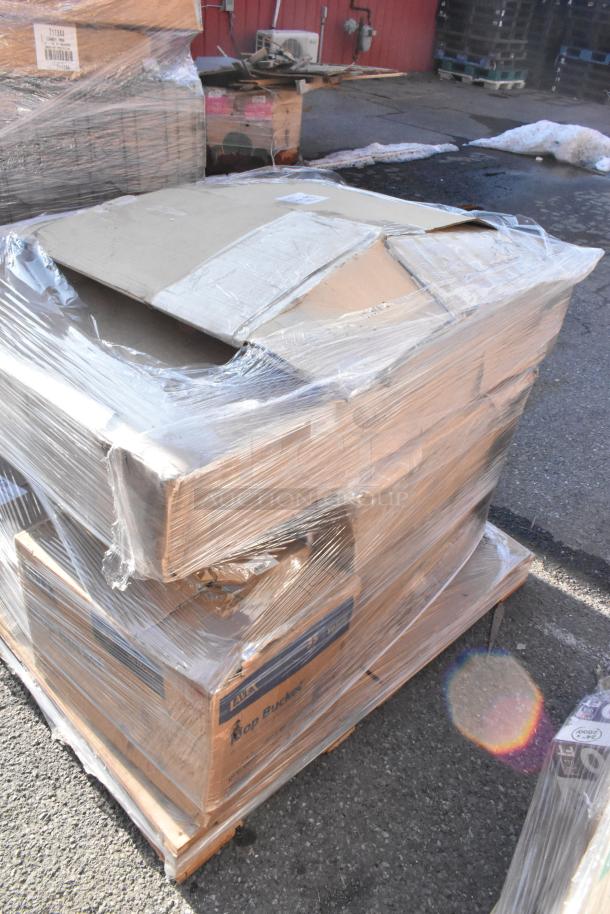 Wrapped pallet with new scratch and dent items, including a Laux Mop Bucket. Cardboard boxes and plastic wrap visible.