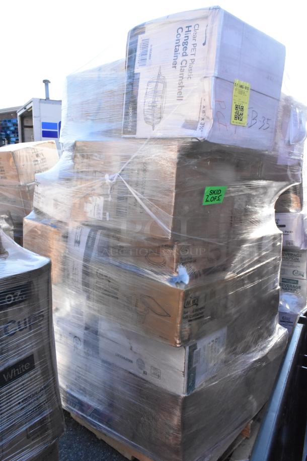 Pallet of assorted brand new scratch and dent items, including boxed paper towels, napkins, and packaging pouches, wrapped in plastic.