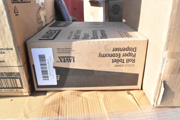 Cardboard boxes labeled "Jumbo Roll Toilet Paper Economy Dispenser" by Lavex, indicating new inventory.