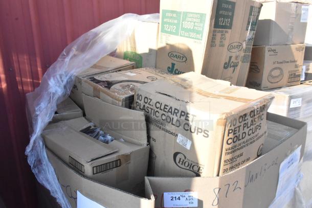 Cardboard boxes of new, scratch and dent items including knives, white bags, and foam cups. Visible labels show quantities and item types.