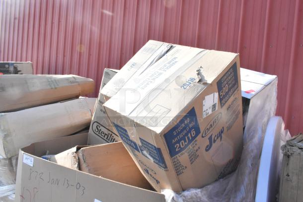 Boxes of brand new scratch and dent items, including a grease trap, speed rail, and sheet pan. Labels indicate assorted sizes.