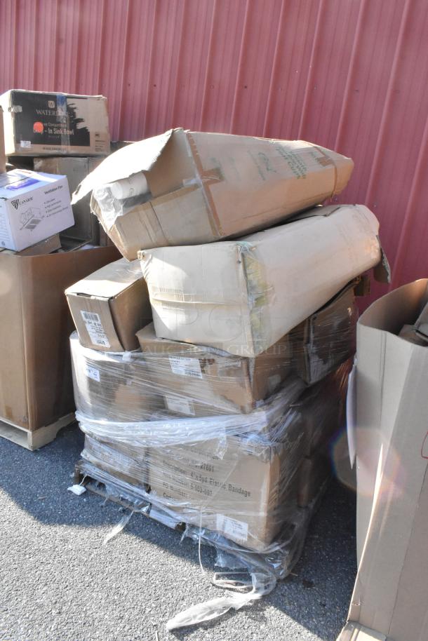 Pallet with 15 assorted brand new scratch and dent items. Includes bandage wraps and hot cups. Boxes intact, some wear visible.