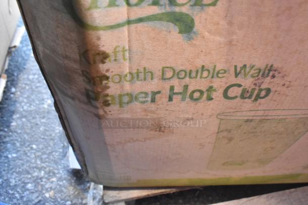 Cardboard box labeled "Kraft Smooth Double Wall Paper Hot Cup," showing visible wear and stains. Contains scratch and dent items.