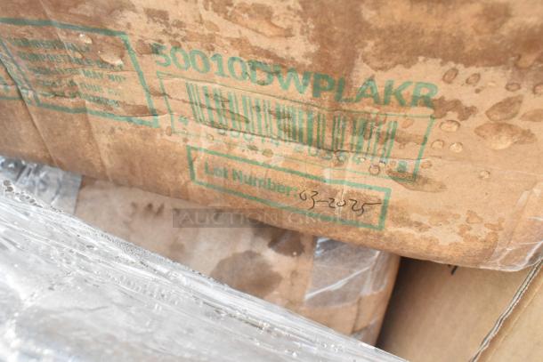 Wet cardboard box with green markings, barcode, and lot number 03-2025, indicating scratch and dent items for auction.