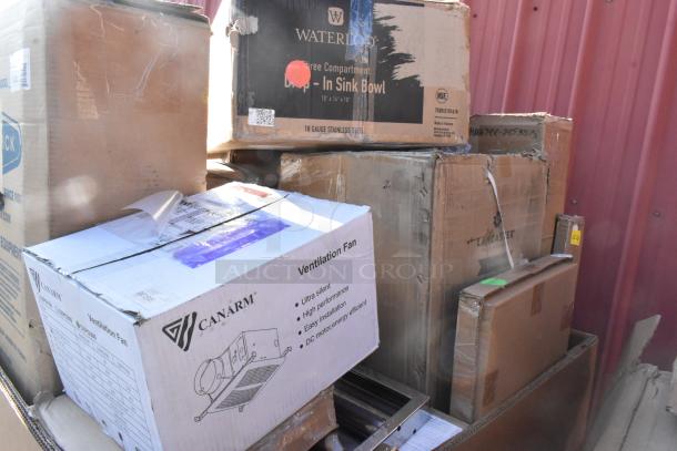 Stack of 14 new scratch and dent items including Bobrick dispenser and Waterloo sink bowl. Boxes show Canarm fan and Lancaster tag.