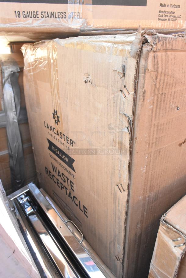 Cardboard box labeled "Lancaster Table & Seating 13 Gallon Waste Receptacle," showing wear with visible stainless steel item.
