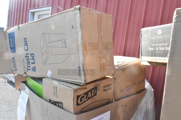 Boxes of new items including Lavex 23-gallon trash can, Glad 13-gallon step can, and Waterloo drop-in sink box. Mixed condition.