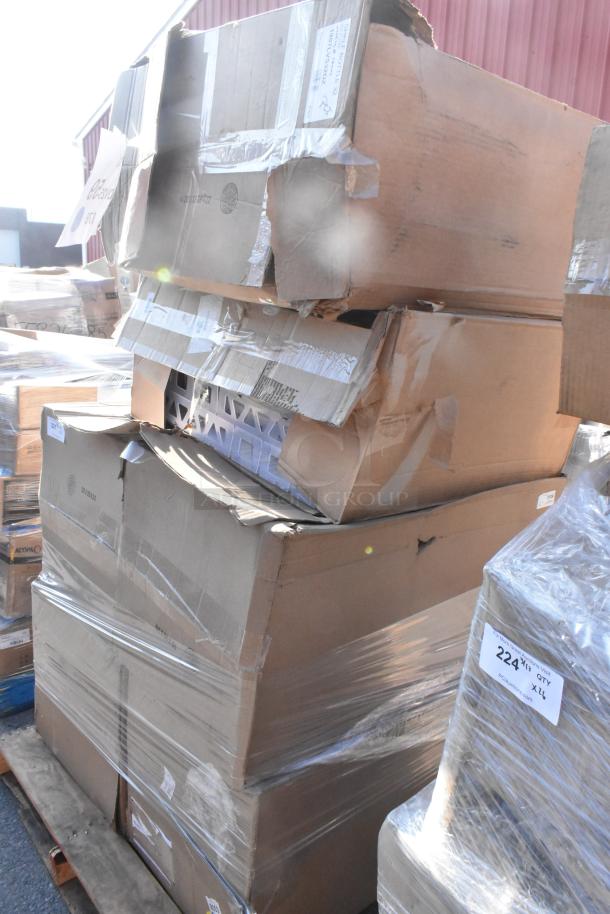 Stack of six new scratch and dent items in damaged boxes, includes a trash can and broom handle, wrapped in plastic.