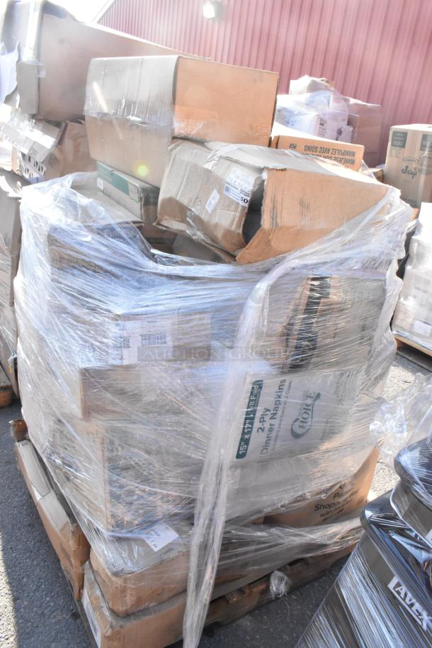 A pallet wrapped in plastic containing various boxes labeled as scratch and dent items, including pouches and containers.