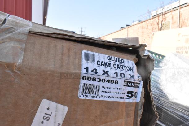 Cardboard box labeled "Glued Cake Carton," dimensions 14x10xX. Marked with "Spec. #1653," "Job#P0002115," and quantity 50.