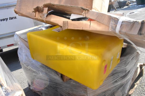 Stacked auction items including a yellow partition, ingredient bin, and mop bucket with damaged packaging. New, scratch, and dent condition.