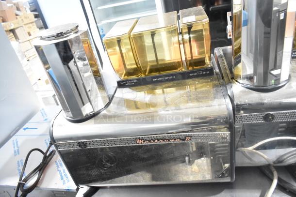 Thermoplan Mastrena commercial espresso machine, countertop design, 250V, visible labels for espresso types, in used condition.