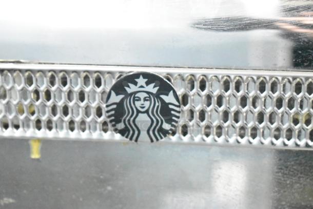 Thermoplan Mastrena espresso machine, commercial countertop model, stainless steel, 250 volts, Starbucks logo on grille.