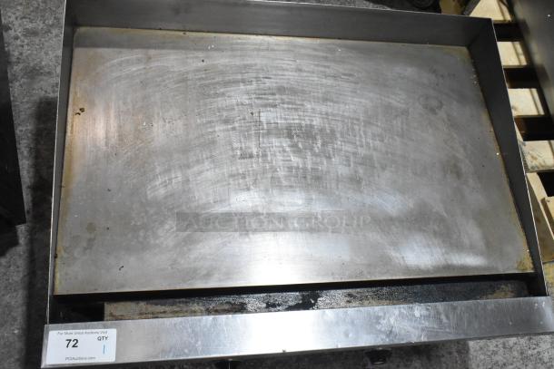 Commercial countertop gas flat top griddle, stainless steel, used condition, visible wear. Auction tag shows "72 QTY 1."