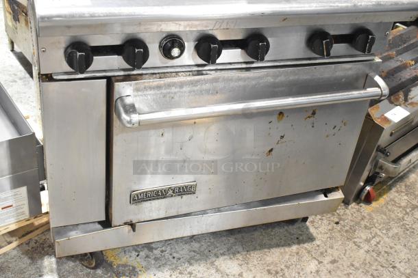 American Range commercial gas-powered 6-burner range with oven, overshelf, backsplash, and casters. Used condition.