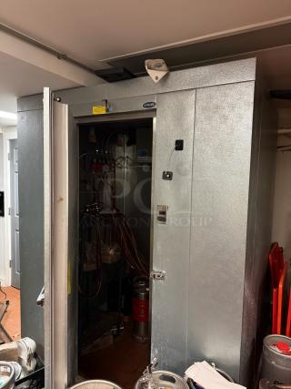 6'x6' Norlake walk-in box with door open, showing interior and refrigeration components. Visible labels: Norlake, Bohn. Condition appears used.