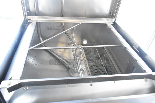 Jackson TempStar HH-E commercial dishwasher interior view, high hood model, new with minor scratches, electric booster heater.