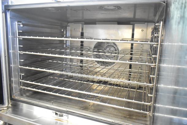 Blodgett HV-100G HydroVection commercial gas oven interior, view-through doors, multiple racks, in good condition.