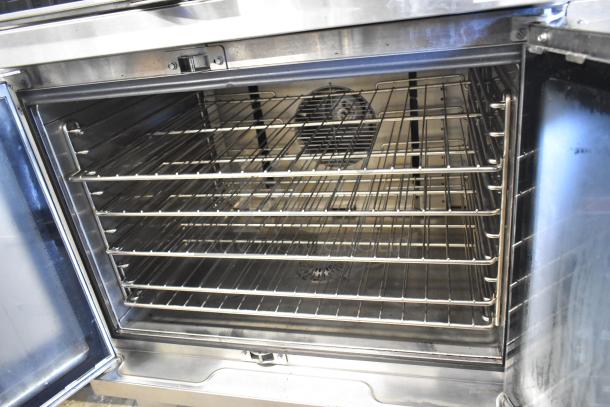 Blodgett HV-100G HydroVection convection oven, view-through doors, thermostatic controls, commercial casters, excellent condition.