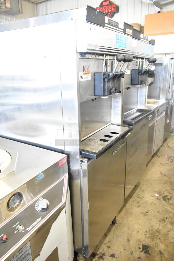 Electro Freeze 30T-RMT-137 water-cooled 2-flavor soft serve machine on commercial casters. 208-230V, 1 phase, stainless steel body.