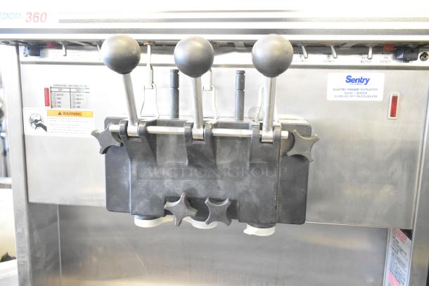 Electro Freeze 30T-RMT-137 soft serve machine, water cooled, 2-flavor w/ twist, on casters, visible operating instructions.