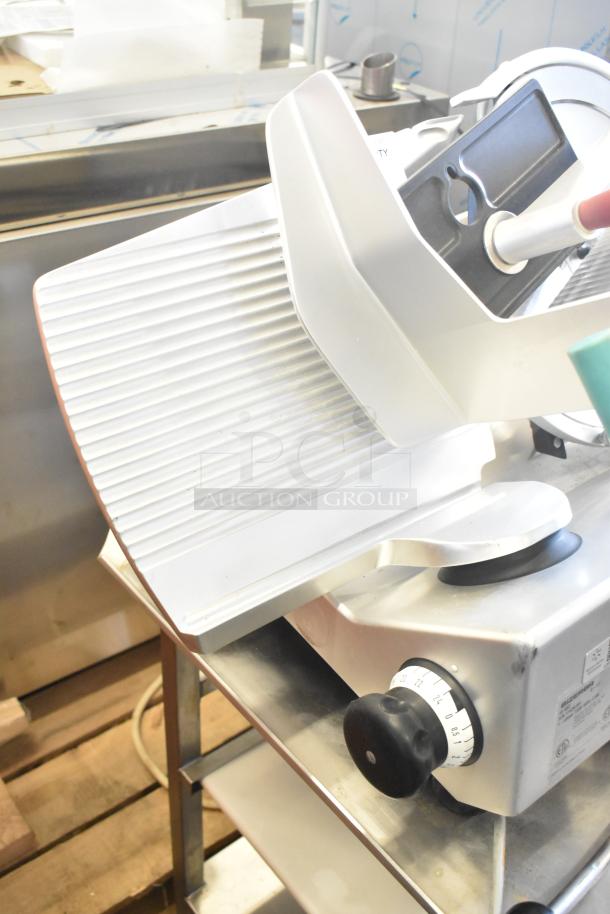 2017 Bizerba GSP HD meat slicer on stand. Features adjustable thickness, 120V, and 1 phase. In good condition.