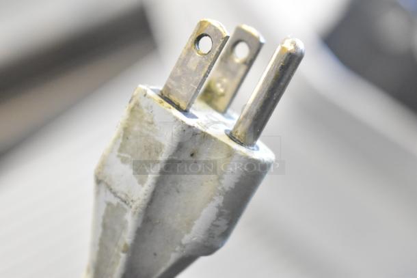 Close-up of a three-prong plug for the 2017 Bizerba GSP HD commercial meat slicer, highlighting its electrical connection.