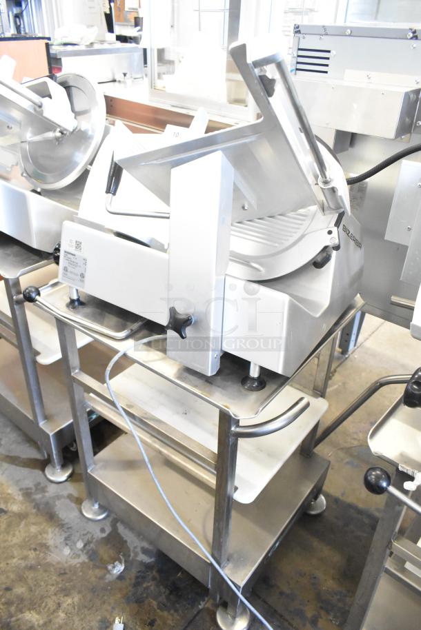 Bizerba GSP H meat slicer on equipment stand, 120V, 1 phase. Stainless steel finish, includes control knobs and power cord.