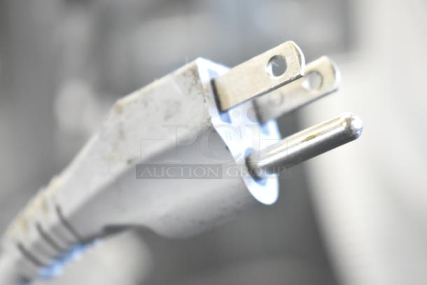 Bizerba GSP H meat slicer plug on Face to Face equipment stand. 120 volts, 1 phase; close-up view of power cord plug.