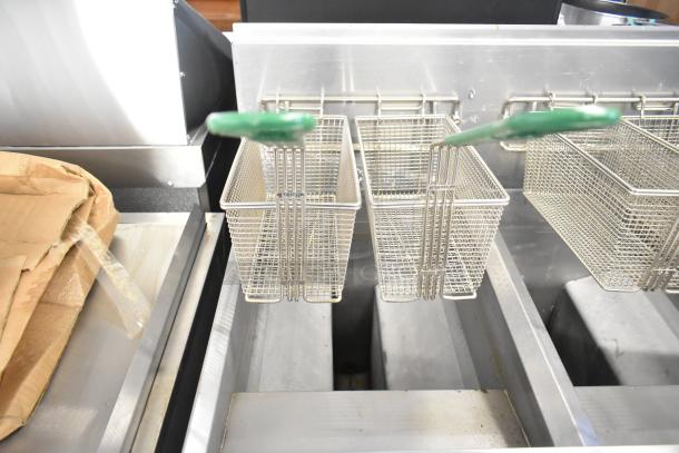 BRAND NEW 2021 Frymaster FPPH255CSE propane gas fryer with 4 metal baskets, filtration system, and casters, 80,000 BTU.