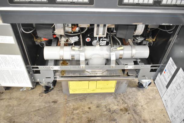 Brand new Frymaster FPPH255CSE propane deep fat fryer with 4 metal baskets, filtration system, on casters. 80,000 BTU.