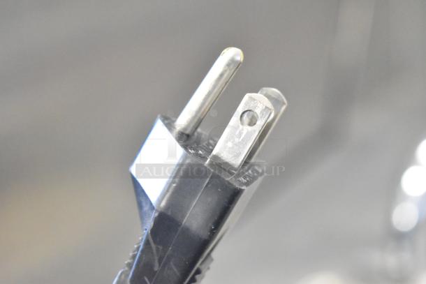 Close-up of a power plug for the BK Resources BK-DIS-1515 commercial portable sink, 120 volts, single phase.