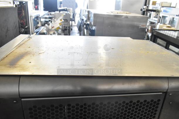 LATE MODEL JBT 2ND-GEN-MFJ-HE citrus juicer on commercial casters. Floor style, 120 volts, signs of wear on top surface.