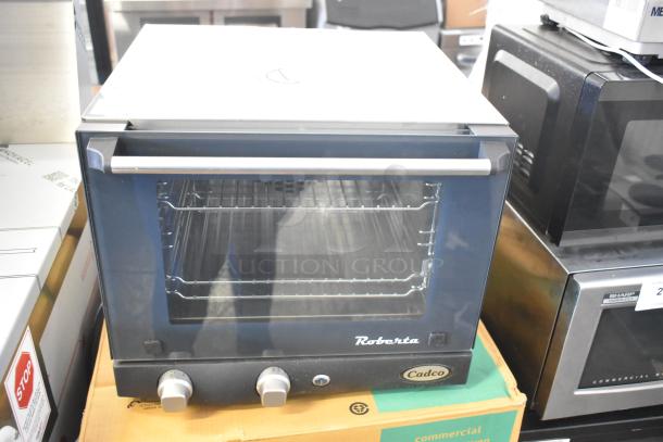 2024 Cadco Unox XAF003-US Roberta metal convection oven, electric, countertop model, 120 volts, visible dials, good condition.