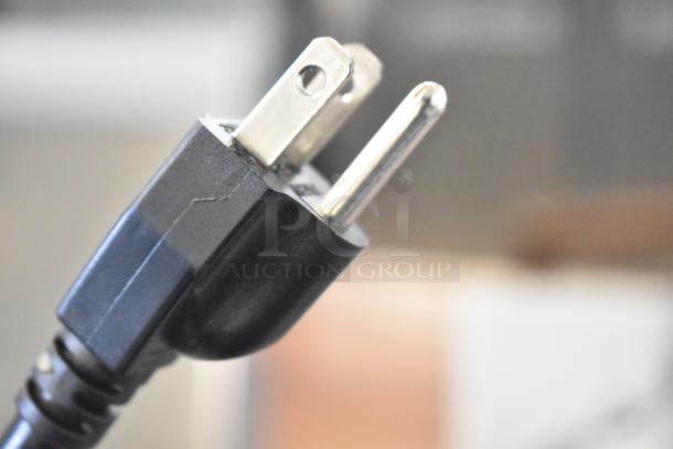 Close-up of a three-prong plug for a 2024 Cadco Unox XAF003-US Roberta Commercial Convection Oven, 120V, 1 Phase.