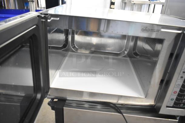 2022 Amana RCS10TS Commercial Microwave Oven, 120V, open door view. Stainless steel interior, visible control panel.