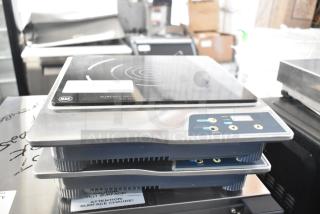 Two 2017 Chic Chefs CC-050S induction burners, 120V, 1 Phase, featuring digital controls and NSF certification.